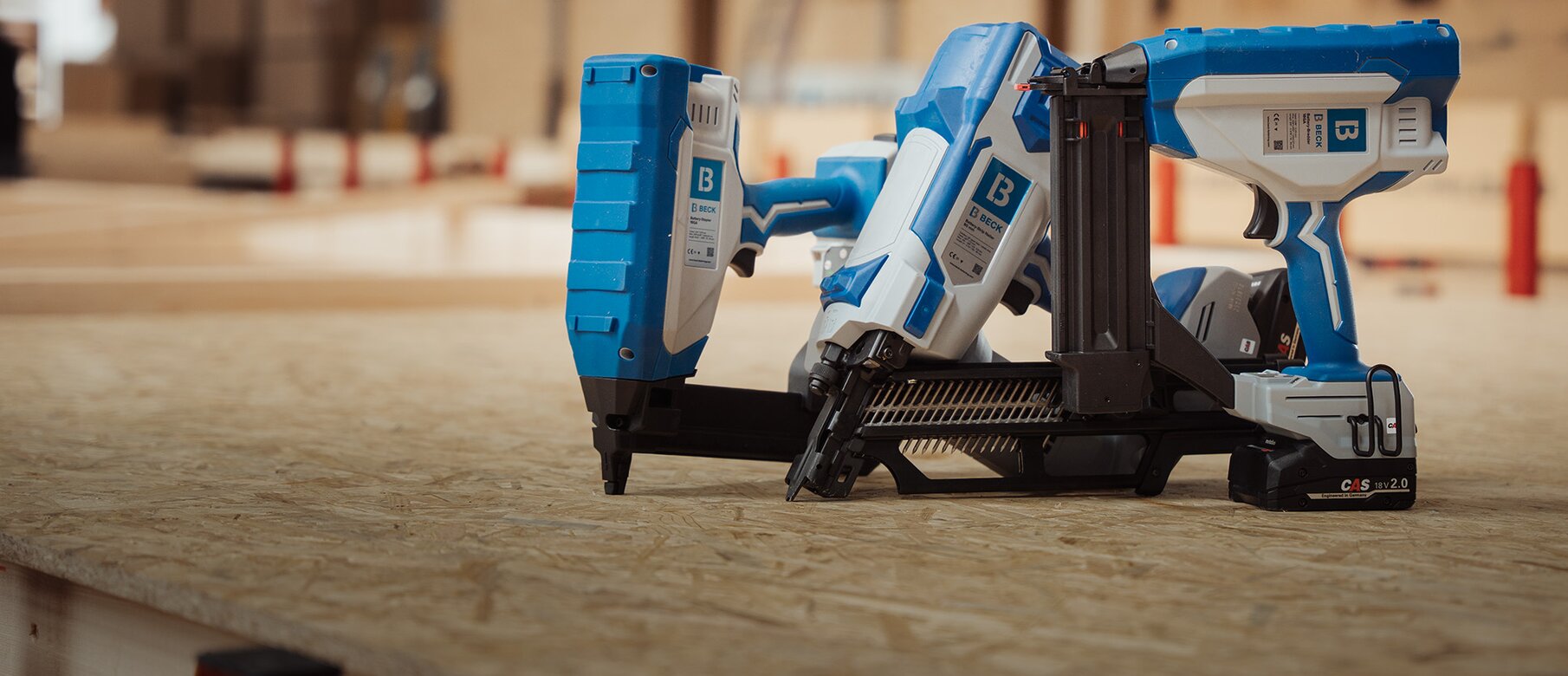 BECK 33° cordless strip nailer with CAS battery, close-up on wood
