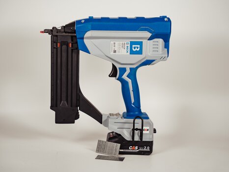 BECK battery-powered brad nailer with loaded magazine and brad nails on white background.