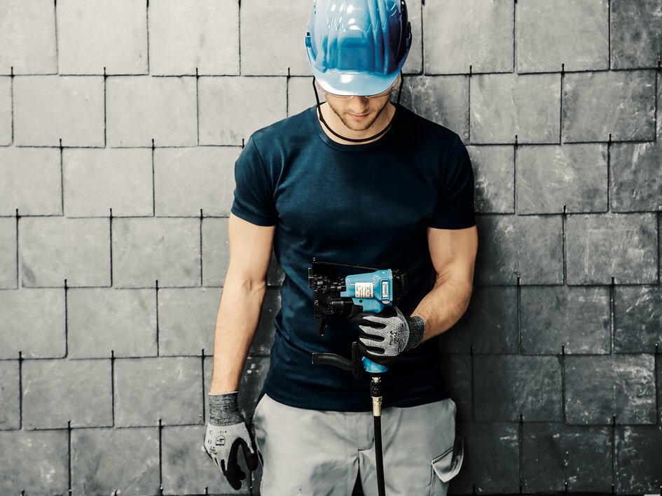 Worker with roofing hook system