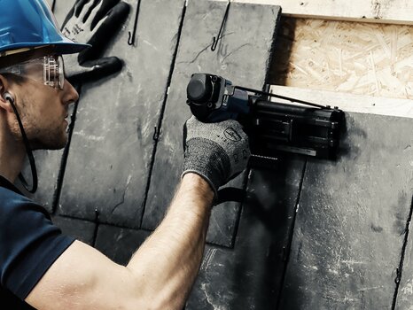 Worker shoot roofing hooks