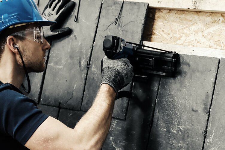 Worker shoot roofing hooks